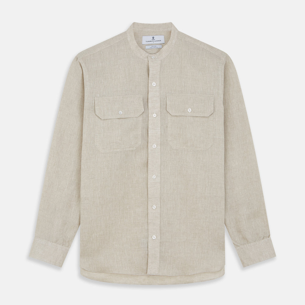 The Turnbull & Asser Light Oatmeal Linen Weekend Fit Unwin Shirt features long sleeves, a band collar, and two chest pockets—an ideal choice for effortless summer style.