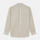 The Turnbull & Asser Light Oatmeal Linen Weekend Fit Unwin Shirt features long sleeves, a band collar, and two chest pockets—an ideal choice for effortless summer style.