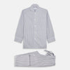 View 1 of product The Turnbull & Asser Pale Blue Multi Stripe Cotton Quin Pyjamas, featuring a long-sleeve button-up top and matching adjustable tie-waist pants, are neatly arranged on a white background.