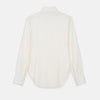 View 3 of product The Cream Silk Tailored Bianca Shirt by Turnbull & Asser features long sleeves, a pointed collar, and curved hem in soft-touch peace silk with a tailored fit. Shown laid flat on a white background.
