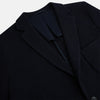 View 2 of product The Turnbull & Asser Navy Knitted Cambridge Blazer features a single-breasted design with three front patch pockets and two buttons, shown against a plain white background.