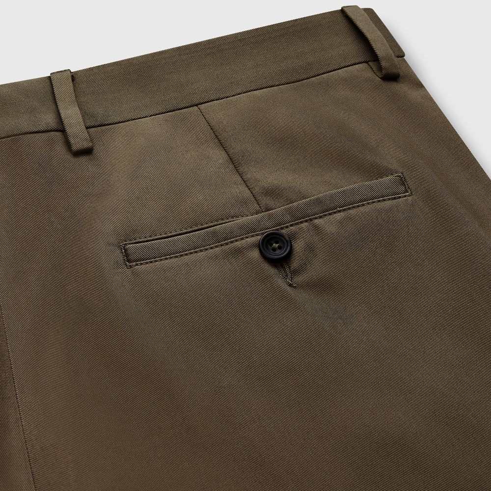 Close-up of the back of Turnbull & Asser's Khaki Green Cotton Twill Manson Trouser, featuring a single buttoned back pocket, belt loops, and fine stitching details—a menswear essential.