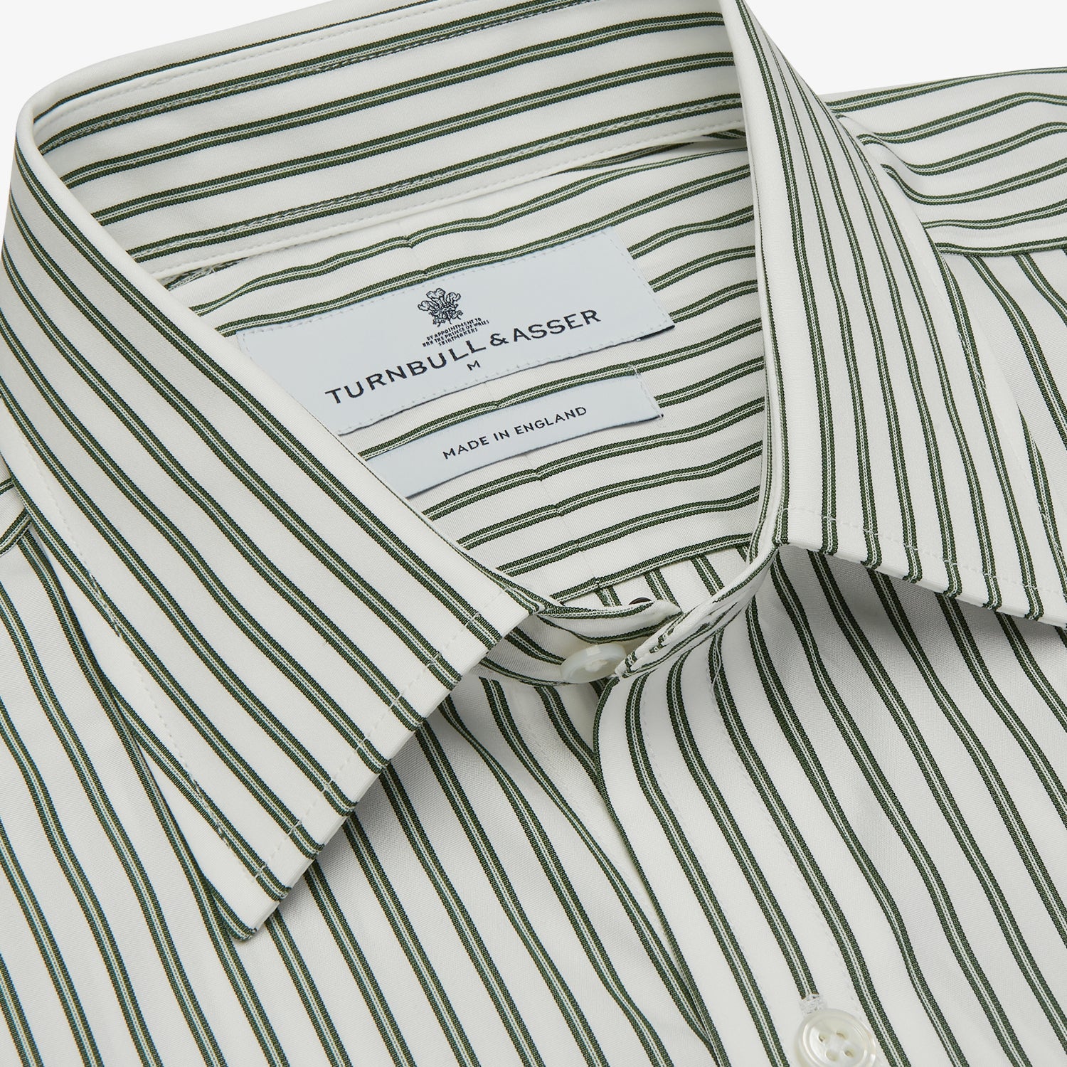 View 4 of product The Turnbull & Asser Green Stripe Weekend Fit Shirt features a derby collar, 1-button cuffs, and relaxed fit, perfect for smart-casual style, shown laid flat on a white background.