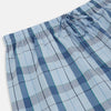 View 2 of product Turnbull & Asser Blue Multi Check Pyjama Trousers, featuring intersecting blue and white lines and a drawstring waistband, laid flat on a white background. Perfect to pair with your favorite cotton T-shirt for cozy comfort.