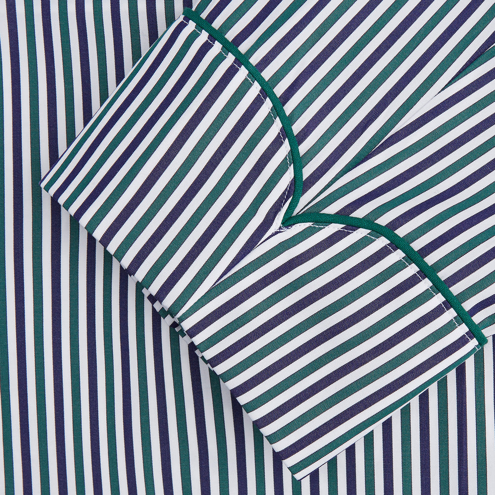 The Turnbull & Asser Green and Blue Stripe Cotton Arnold Gown features long sleeves, a knee-length cut, a shawl collar, front pockets, and an elegant wrap belt at the waist.