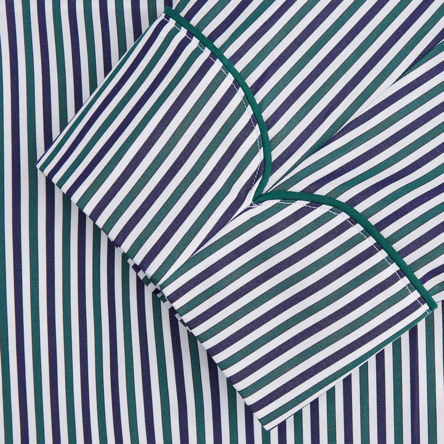 View 3 of product The Turnbull & Asser Green and Blue Stripe Cotton Arnold Gown features long sleeves, a knee-length cut, a shawl collar, front pockets, and an elegant wrap belt at the waist.