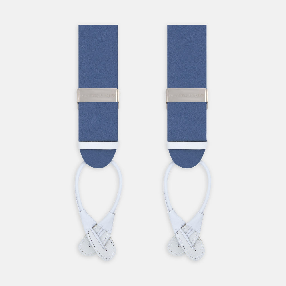 The Turnbull & Asser Blue Adjustable Felt Braces feature silver clasps and white leather ends, ideal for smart occasions. Shown on a light background.
