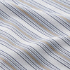 View 4 of product The Turnbull & Asser Sand Multi Stripe Regular Fit Shirt features a T&A collar, 3 button cuffs, and vertical blue, white, and light brown stripes. The shirt is shown neatly laid flat on a white background.