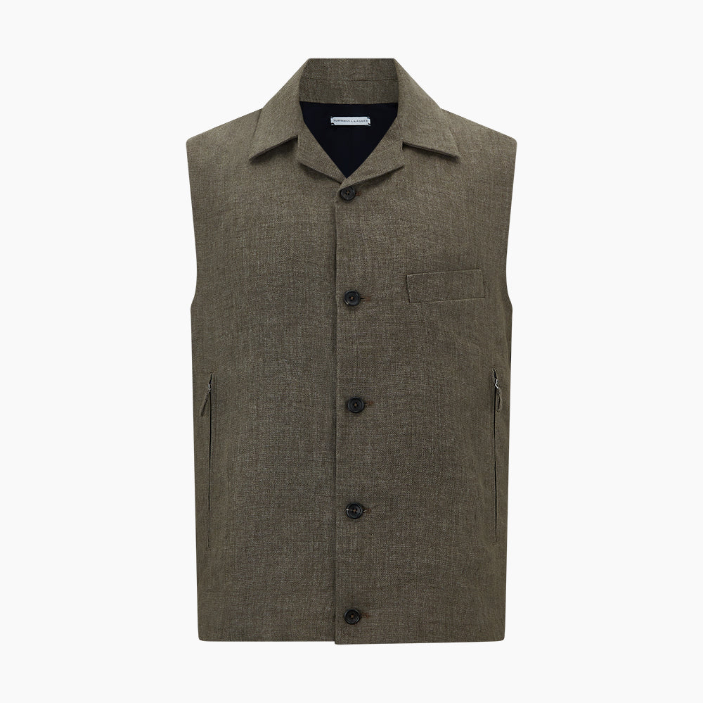 The Turnbull & Asser Olive Collared Linen Waistcoat is a sleeveless olive waistcoat with a collar, front buttons, one chest pocket, and two zippered side pockets, shown against a plain white background.