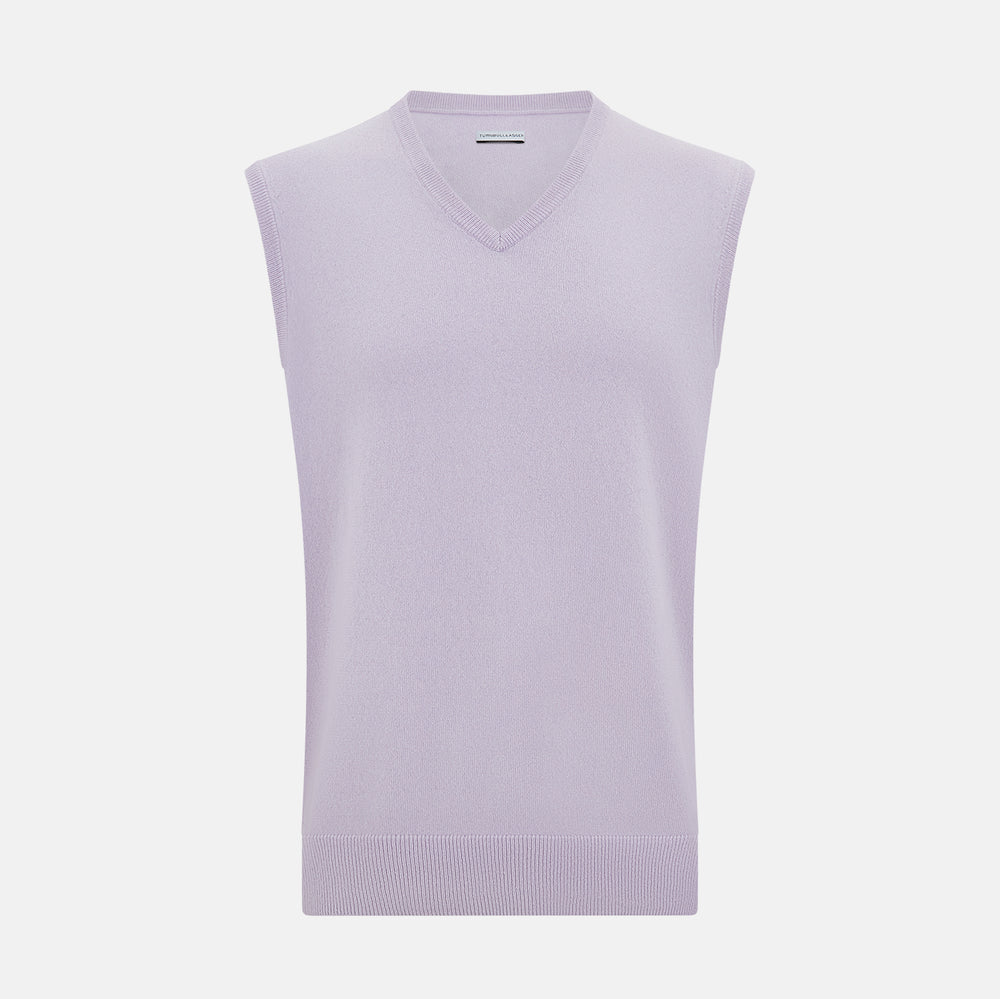 The Turnbull & Asser Lilac Cashmere V-Neck Vest is a sleeveless knit with a ribbed hem, showcasing sophisticated style in light purple against a plain white background.