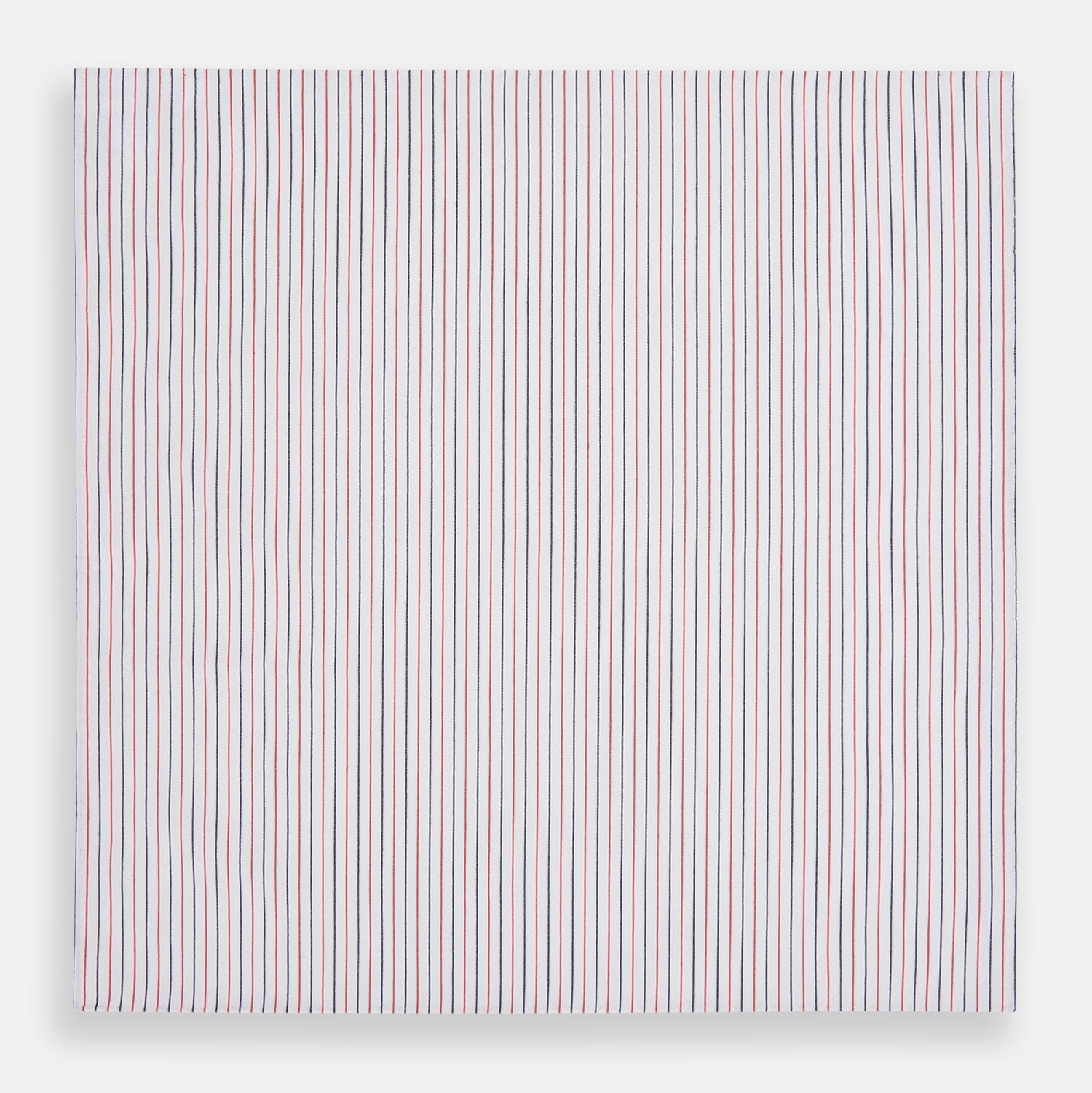 View 3 of product The Turnbull & Asser Hand Rolled Red and Navy Pinstripe Handkerchief features evenly spaced vertical stripes on white cotton, offering a clean, classic look as an elegant gentleman's accessory or stylish pocket square.