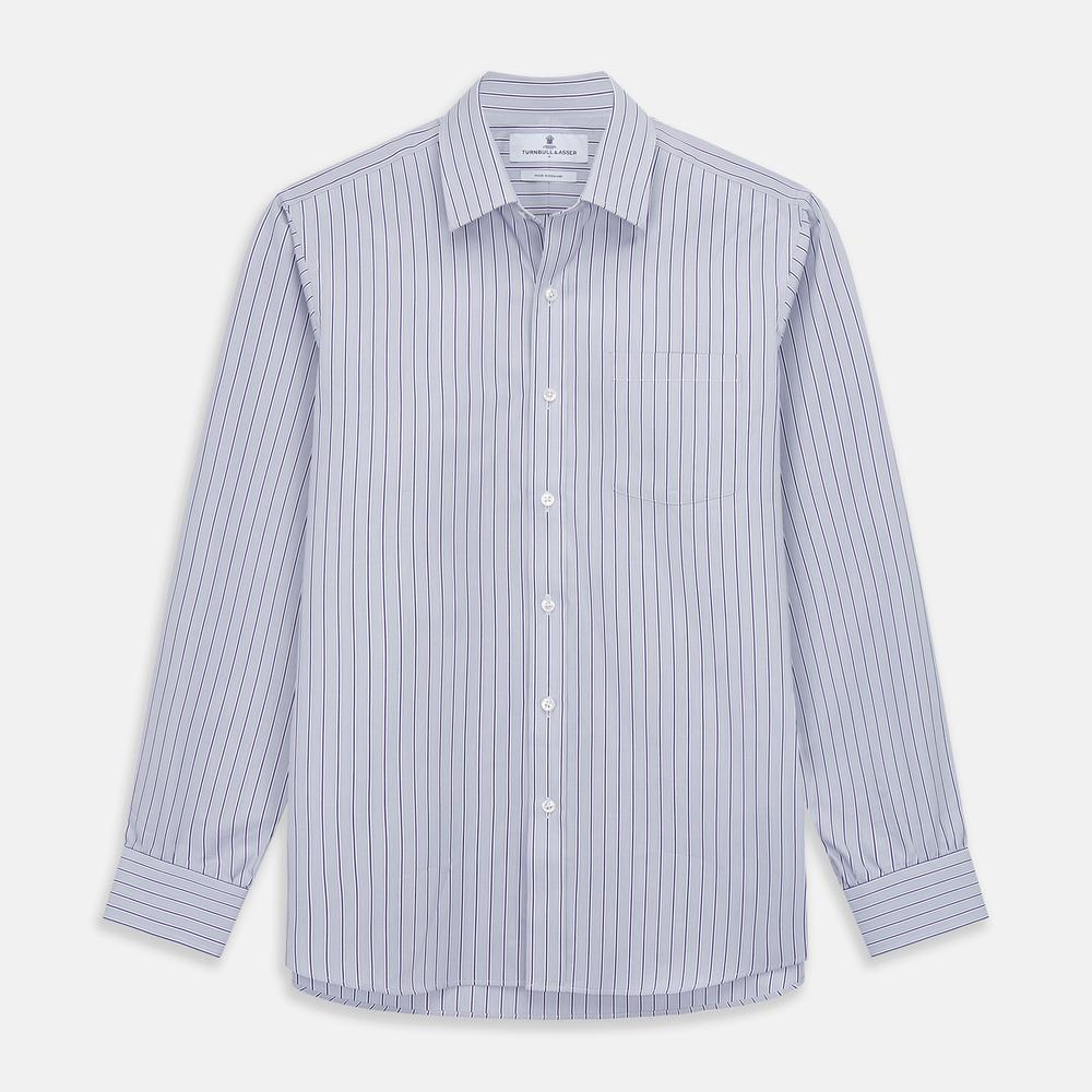 Close-up of Turnbull & Asser's Navy & Blue Stripe Cotton Fabric, featuring thin wavy blue stripes and a slightly textured white surface, displayed in a circular frame against a plain background.