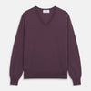 View 1 of product The Turnbull & Asser Plum Kennedy Merino V-Neck Jumper is a long-sleeved knitwear piece made from soft Italian wool, shown laid flat on a white background.