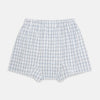 View 2 of product Turnbull & Asser's Blue Multi Graph Check Godfrey Boxer Shorts for men in Italian cotton feature a white base with a blue and black plaid pattern, shown flat against a plain white background.