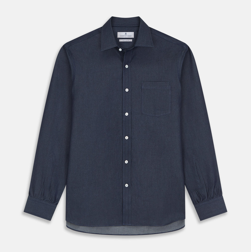 The Turnbull & Asser Blue Weekend Fit Finch Shirt features a Derby collar, chest pocket, classic white buttons, and timeless style, all in cotton. Laid flat on a white background.