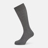 View 1 of product A single Steel Melange Micro Knit Mid-Length Sock by Turnbull & Asser, knee-high and gray, crafted from mercerised Egyptian cotton with a subtle micro knit pattern, is displayed upright on a plain white background.