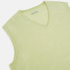 View 2 of product The Turnbull & Asser Melon Green V-neck Cashmere Vest features a ribbed hem and sleeveless design, ideal for a distinguished look. Presented against a plain white background.
