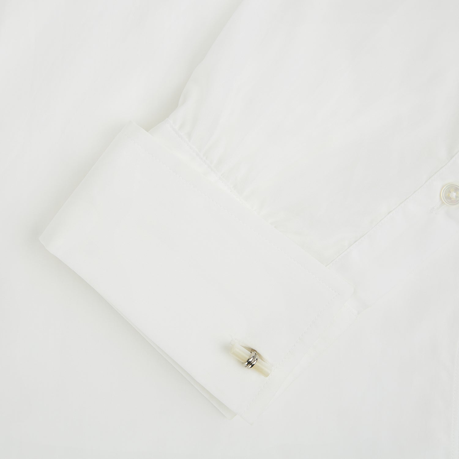 View 3 of product Turnbull & Asser Mother of Pearl Handlebar Cufflinks feature sleek cylindrical white bars, elegantly displayed against a plain white background.