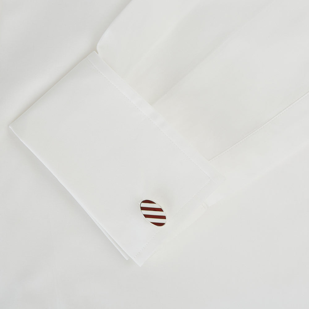 Turnbull & Asser's Burgundy and White Striped Oval Enamel Cufflinks feature a diagonal pattern in silver, embodying masculine elegance.