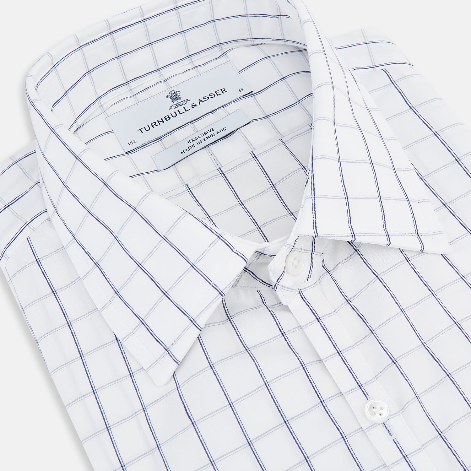 View 2 of product A Dark Navy Double-Line Checked Westminster Shirt by Turnbull & Asser, featuring button-down front, pointed collar, and buttoned cuffs—displaying British craftsmanship—laid flat on a white background.