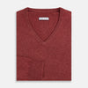 View 4 of product The Turnbull & Asser Burgundy Crew V-Neck Cashmere Jumper is a long-sleeve knitwear piece with ribbed cuffs, hem, and neckline, shown on a white background.