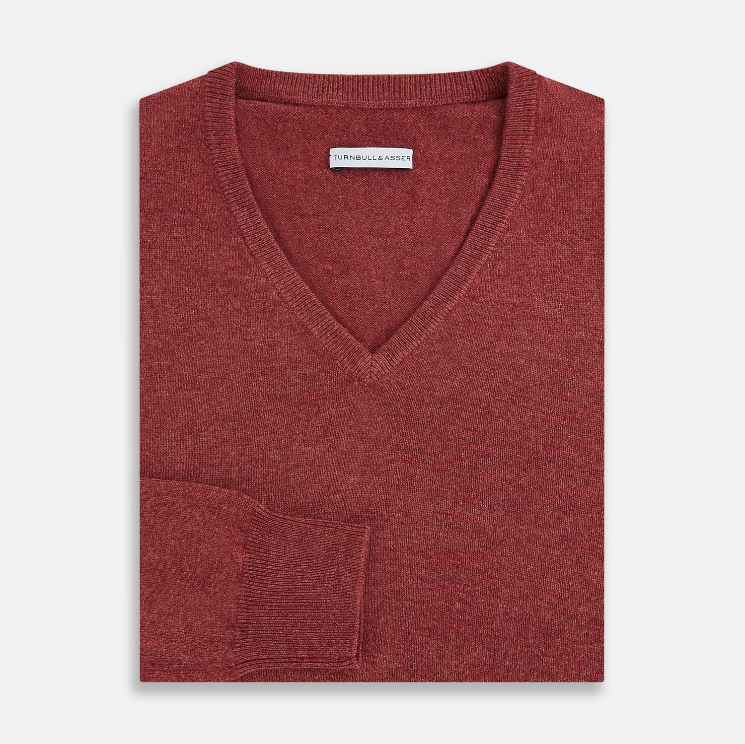 View 4 of product The Turnbull & Asser Burgundy Crew V-Neck Cashmere Jumper is a long-sleeve knitwear piece with ribbed cuffs, hem, and neckline, shown on a white background.