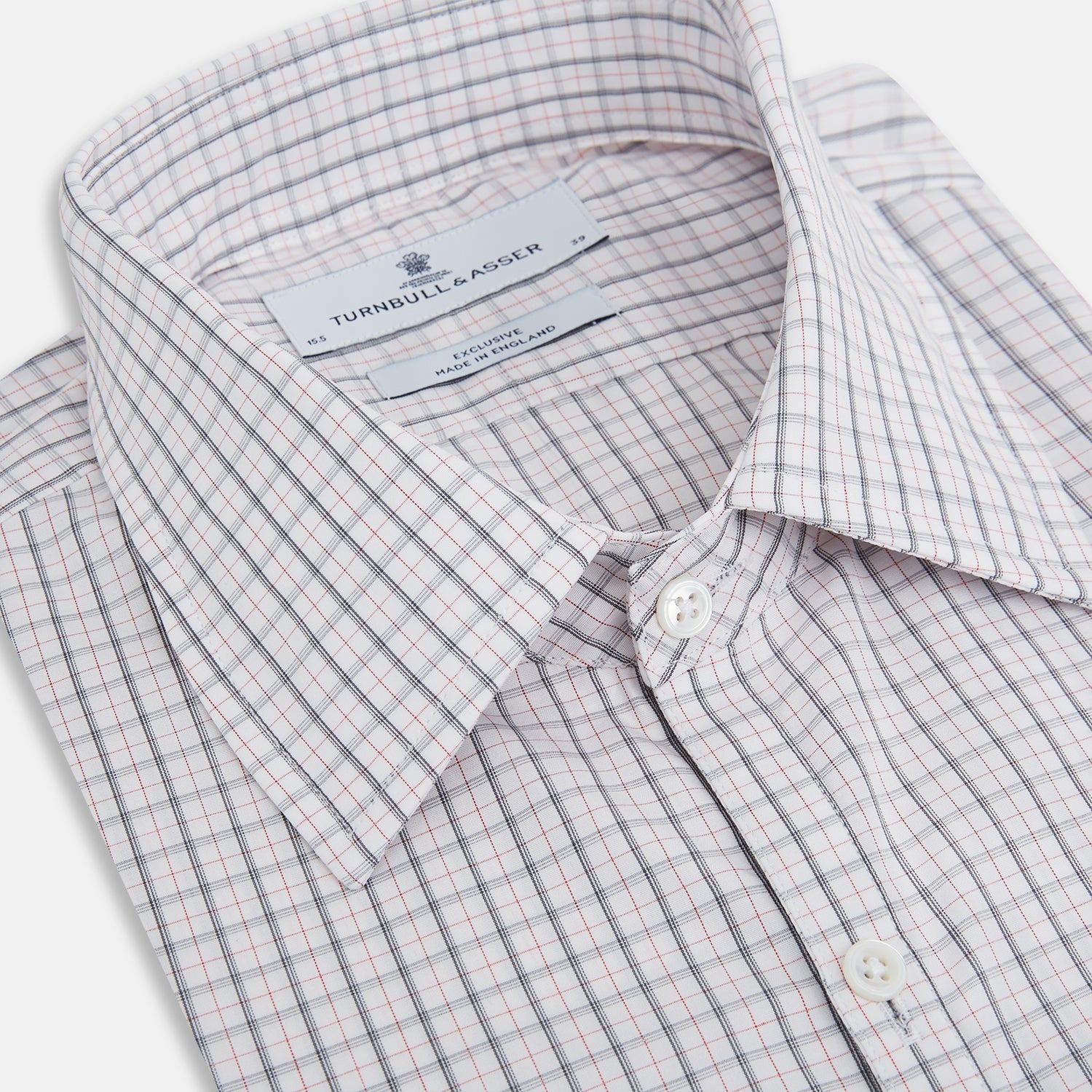 View 2 of product The Blue and Red Graph Check Westminster Shirt by Turnbull & Asser features a classic collar, long sleeves, and British craftsmanship, with a blue and red checkered pattern on white, displayed flat on a white surface.