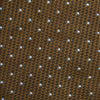 View 4 of product The LACE ON TONE SPOT EARTH RIVER TIE by Turnbull & Asser is a brown woven tie with small light blue dots, shown rolled up on a white background—a stylish accessory for formal outfits.