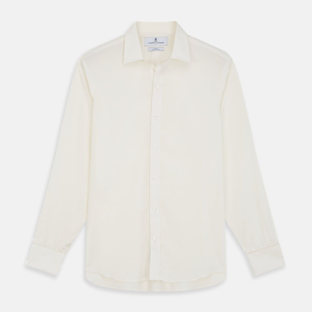 The Turnbull & Asser Cream Silk Weekend Fit Fairlight Shirt is a classic, soft-touch long-sleeve shirt with a collar, button-down front, and buttoned cuffs, shown laid flat on a plain white background.