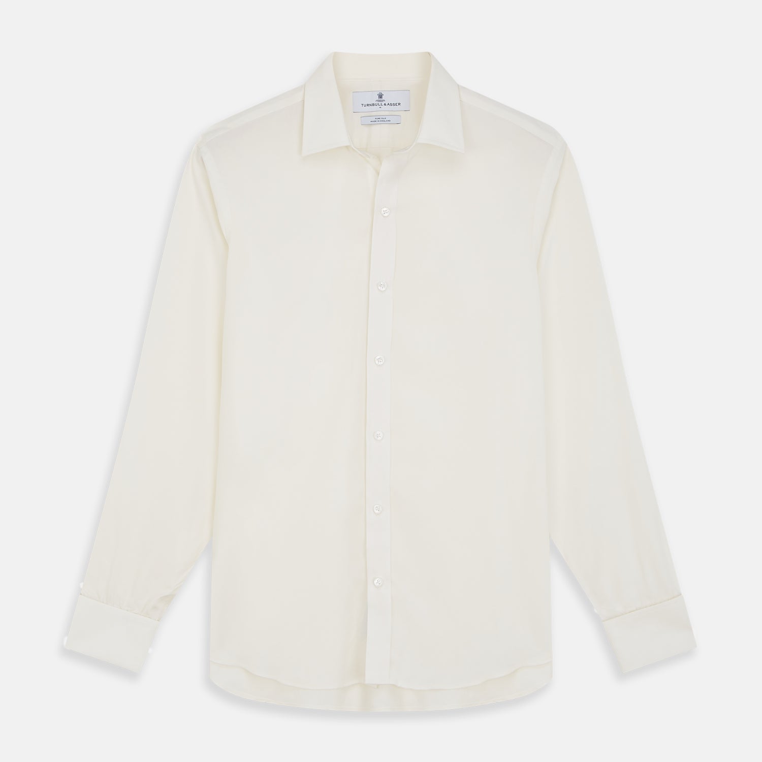 View 1 of product The Turnbull & Asser Cream Silk Weekend Fit Fairlight Shirt is a classic, soft-touch long-sleeve shirt with a collar, button-down front, and buttoned cuffs, shown laid flat on a plain white background.