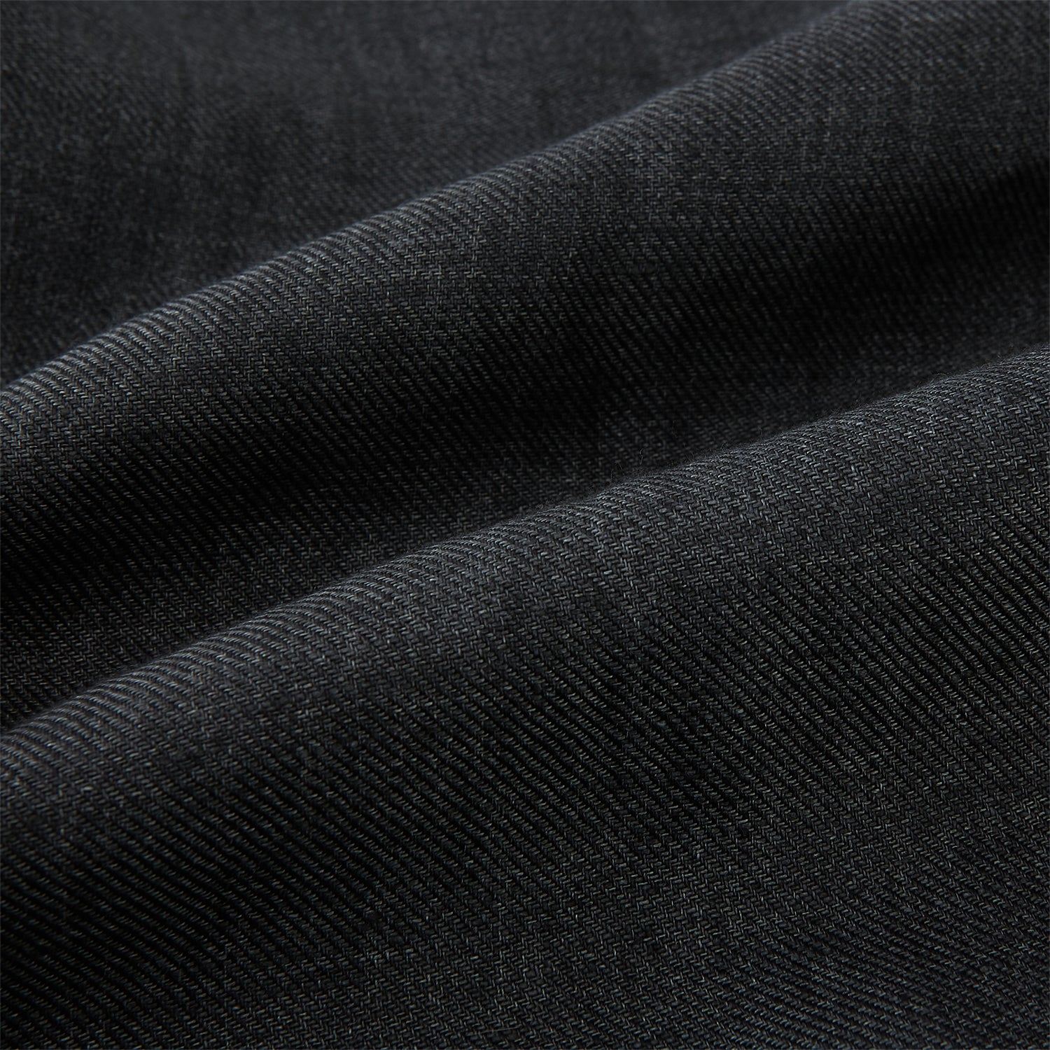 View 8 of product The Ash Linen Windsor Shirt by Turnbull & Asser is a long-sleeve, button-up black shirt with a Windsor collar and cuffs, reflecting British craftsmanship, shown on a plain white background.