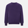 View 3 of product The Turnbull & Asser Purple Cashmere V-neck Jumper features long sleeves with ribbed cuffs and hem—a classic knitwear piece for effortless layering, shown against a white background.