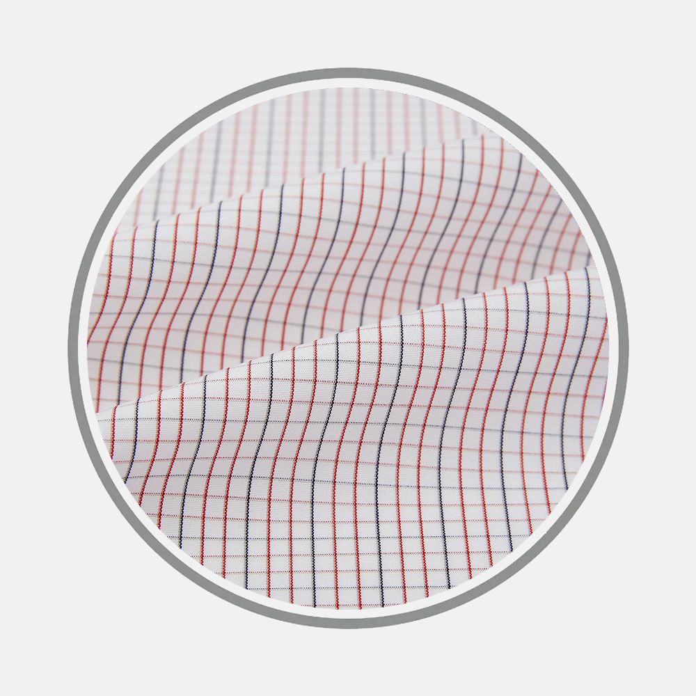 Close-up of Turnbull & Asser's Red And Navy Check Fabric, featuring a white base with thin red and navy grid lines, displayed in a circular frame against a light gray background.