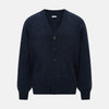 View 1 of product The Navy Melange Cashmere Cardigan by Turnbull & Asser features long sleeves, a V-neck, five dark buttons, ribbed cuffs and hem, and two front pockets. Shown against a plain white background.