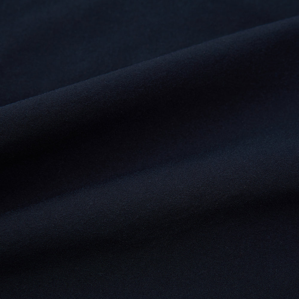 Turnbull & Asser’s Midnight Blue Winston Trousers, in high-twist cotton with belt loops and a button closure, are shown flat against a plain white background.