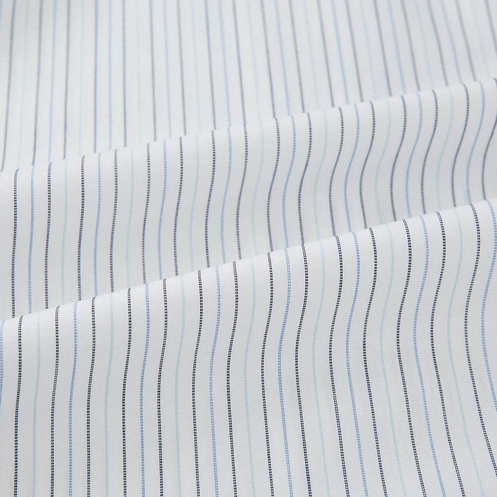 The Turnbull & Asser Blue Multi-Tone Double Pinstripe Mayfair Shirt, crafted from premium Italian cotton with a pointed collar, buttoned cuffs, and long sleeves, is shown on a plain white background.