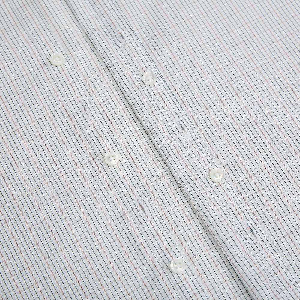 Turnbull & Asser's Forest Melange and Red Micro Check Windsor Shirt features a subtle check pattern, pointed collar, and white buttons—showcasing refined British craftsmanship.