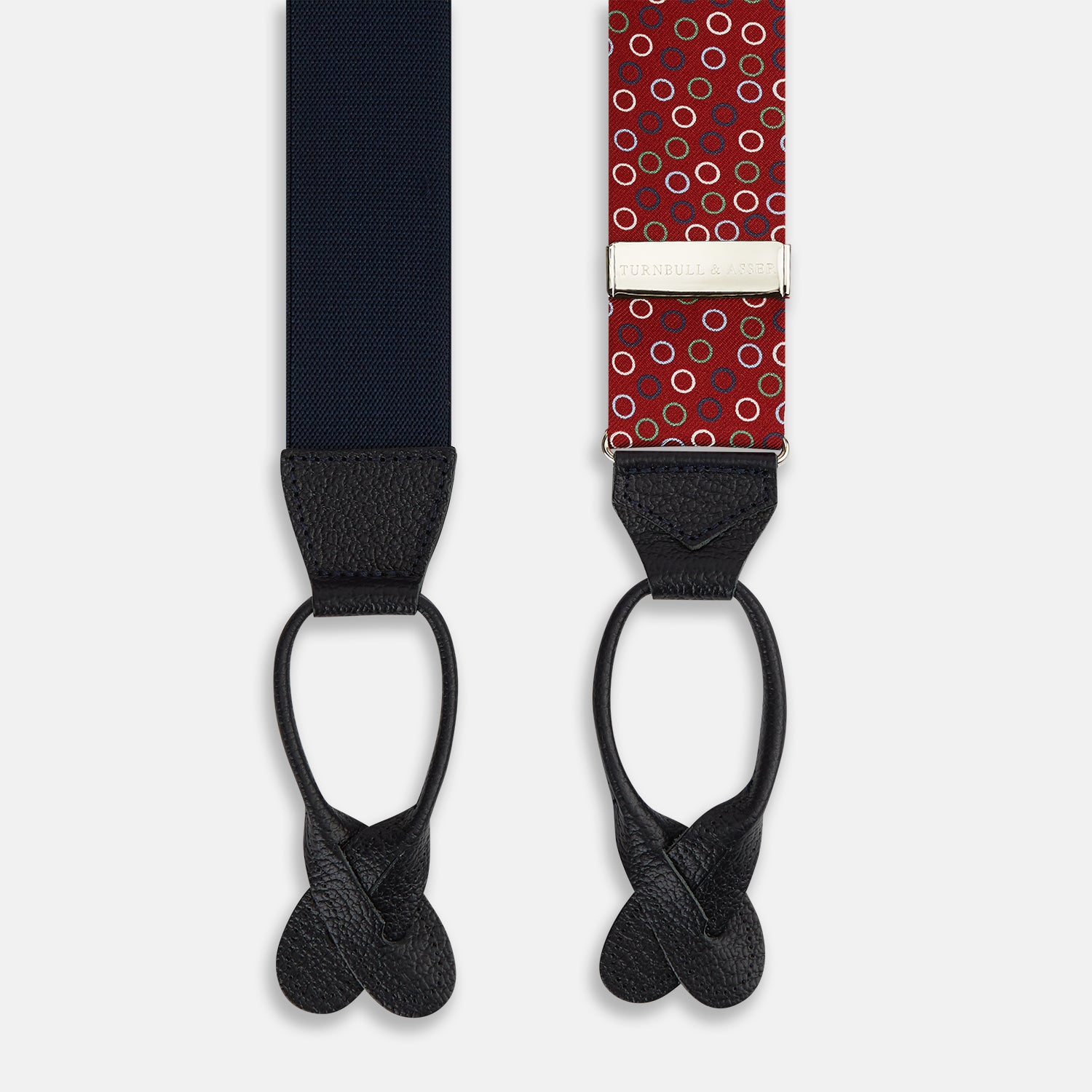 View 2 of product Pink and navy circle red adjustable silk and navy leather braces by Turnbull & Asser, arranged in an M shape on a white background—a refined choice for sartorial styling and standout men’s accessories.