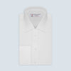 View 1 of product A Turnbull & Asser Two-Fold 200 White Cotton Shirt with T&A collar and double cuffs, neatly folded to show the label inside the collar, is displayed on a light blue background.