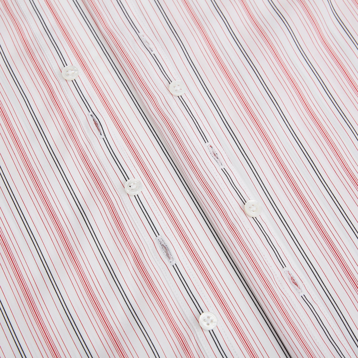 View 7 of product The Red Multi Pencil Stripe Windsor Shirt by Turnbull & Asser features long sleeves, buttoned cuffs, a Turnbull collar, and classic British tailoring with vertical red, pink, and white stripes.