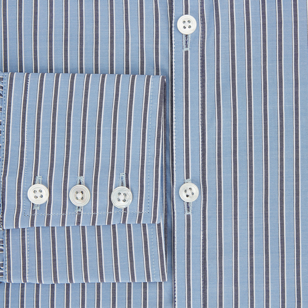 The Steel Blue Ticking Stripe Westminster Shirt by Turnbull & Asser features a classic fit, Turnbull collar, vertical stripes, white buttons, and buttoned cuffs—showcasing refined British craftsmanship.