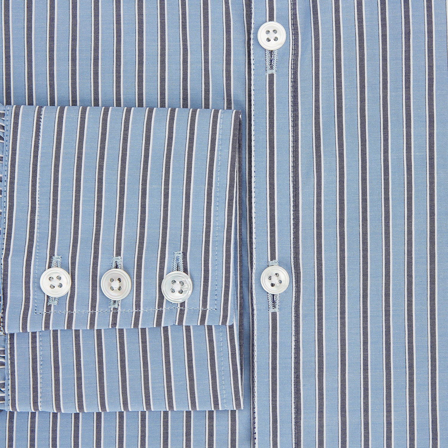 View 4 of product The Steel Blue Ticking Stripe Westminster Shirt by Turnbull & Asser features a classic fit, Turnbull collar, vertical stripes, white buttons, and buttoned cuffs—showcasing refined British craftsmanship.