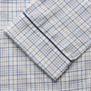 View 3 of product The Turnbull & Asser Blue Multi Check Cotton-Cashmere Modern Pyjama Set features a two-piece design with a long-sleeve button-up top with breast pocket and matching elastic-waist pants in a blue and white check pattern.