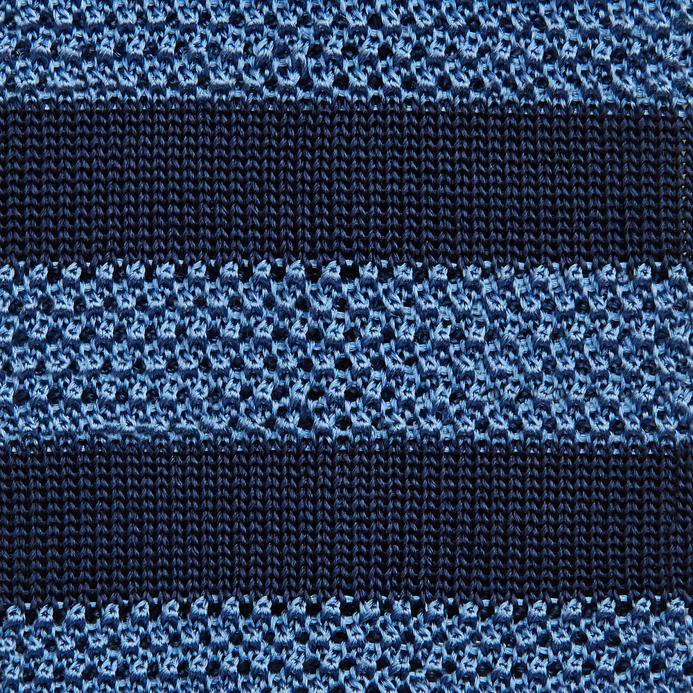 The Turnbull & Asser Navy and Blue Square tipped knitted tie features horizontal stripes and a rolled-up silk design, elegantly displayed on a plain white background.