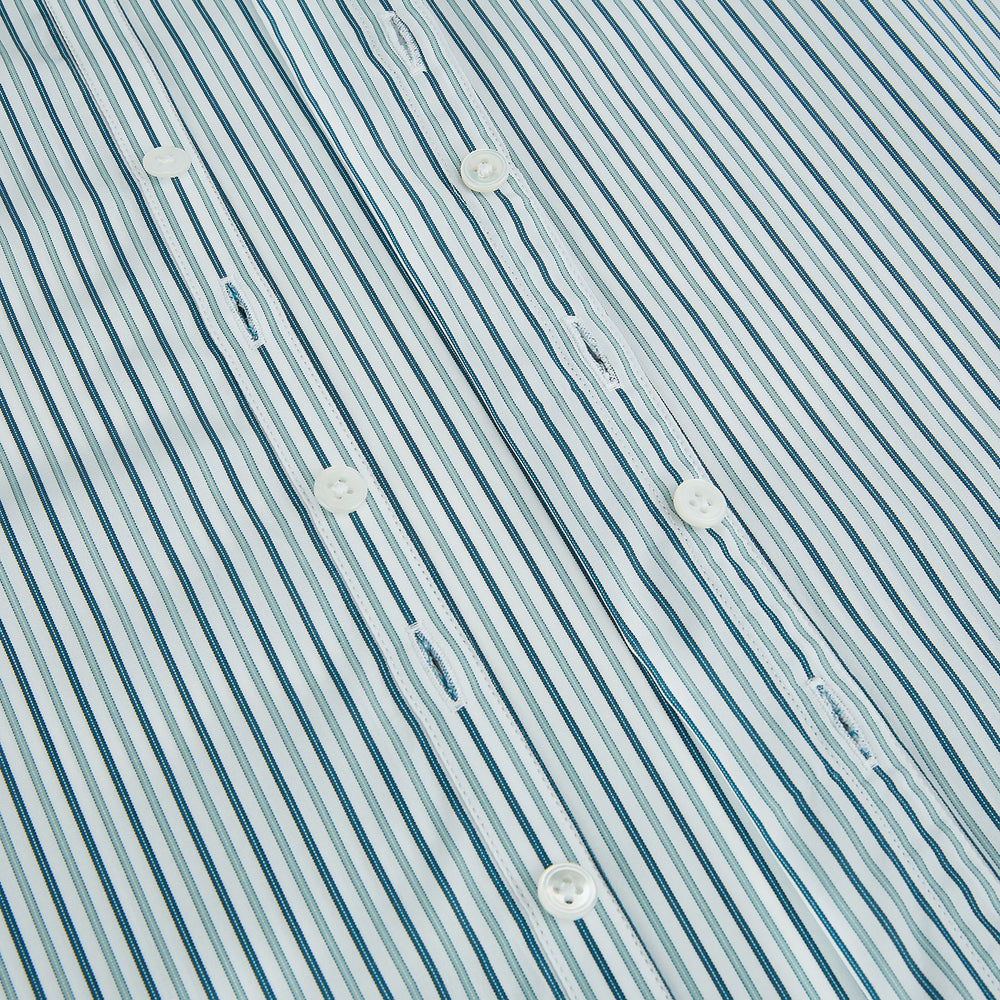 The GREEN DOUBLE STRIPE WESTMINSTER SHIRT by Turnbull & Asser features green and white vertical stripes, a pointed collar, buttoned cuffs, and a relaxed fit that highlights refined British craftsmanship.