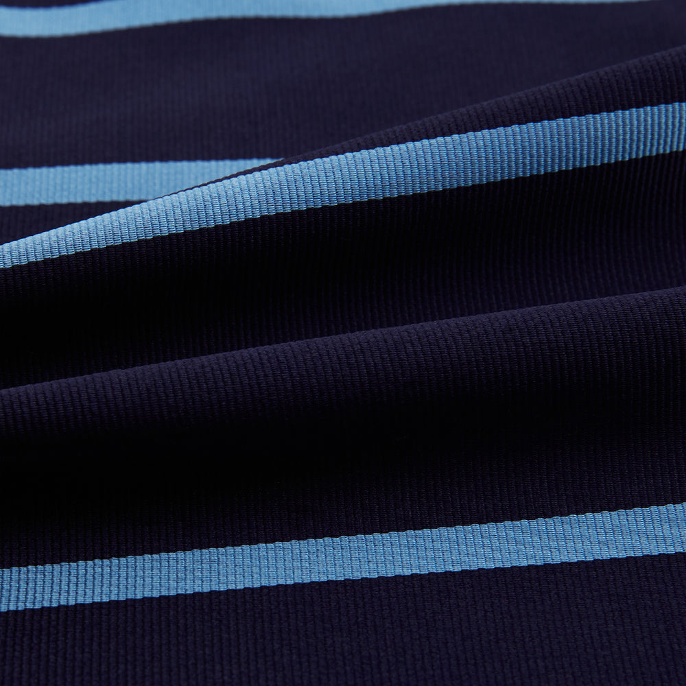 The Turnbull & Asser Azzurro Stripe and Navy Silk Cravat is elegantly displayed against a white background, featuring two horizontal light blue stripes and a bottom edge forming a downward-pointing triangle.
