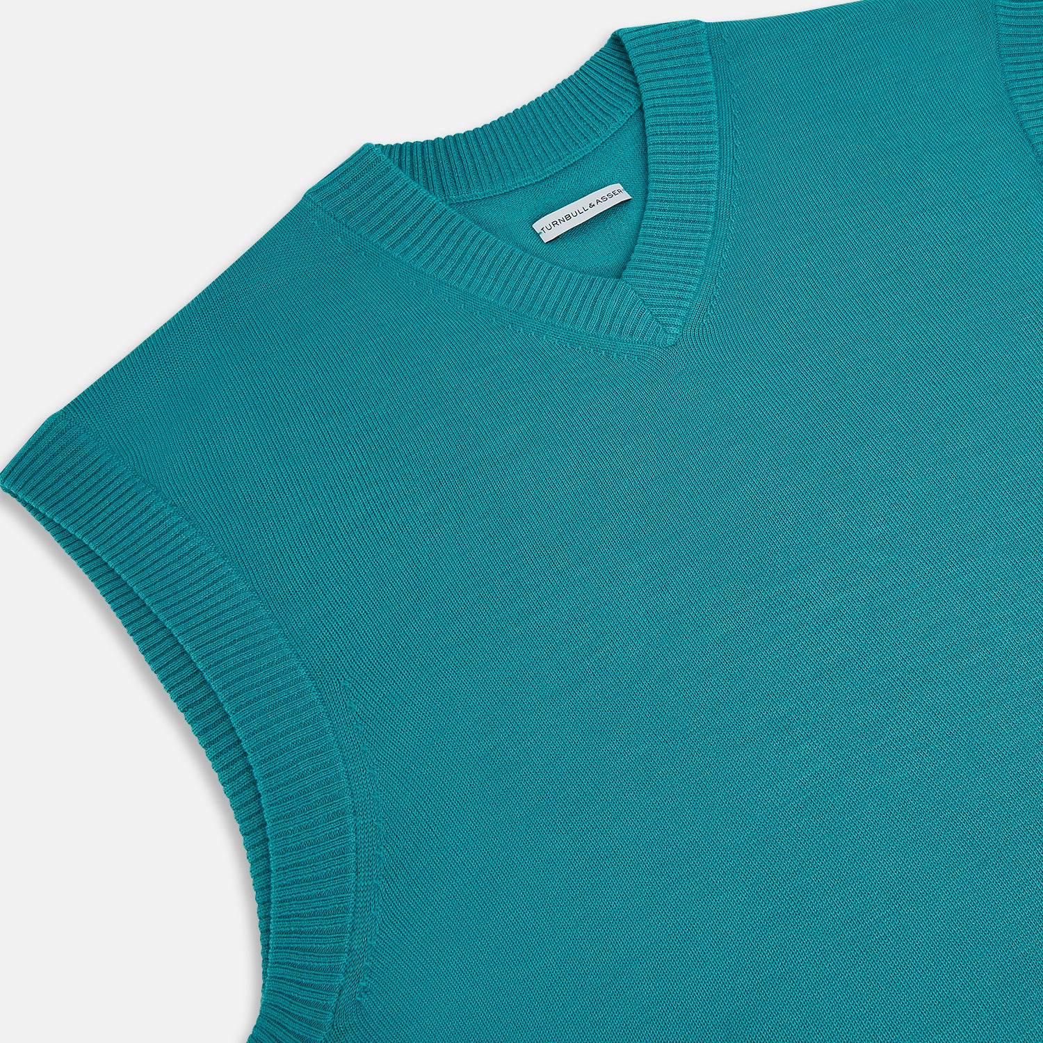 View 2 of product Turnbull & Asser's Turquoise Fine Merino V-Neck Vest features ribbed edges and a sleeveless design, ideal for a refined look, shown against a plain white background.