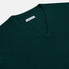 View 2 of product The Turnbull & Asser Forest Green Cashmere V-neck Jumper features ribbed cuffs and hem, shown against a white background—an essential knitwear staple for any wardrobe.