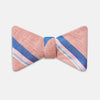 View 1 of product The Thistle-Petersham-Double End Bow Tie by Turnbull & Asser features a pink base with diagonal blue, white, and navy stripes—a versatile accessory perfect for any gentleman's wardrobe.
