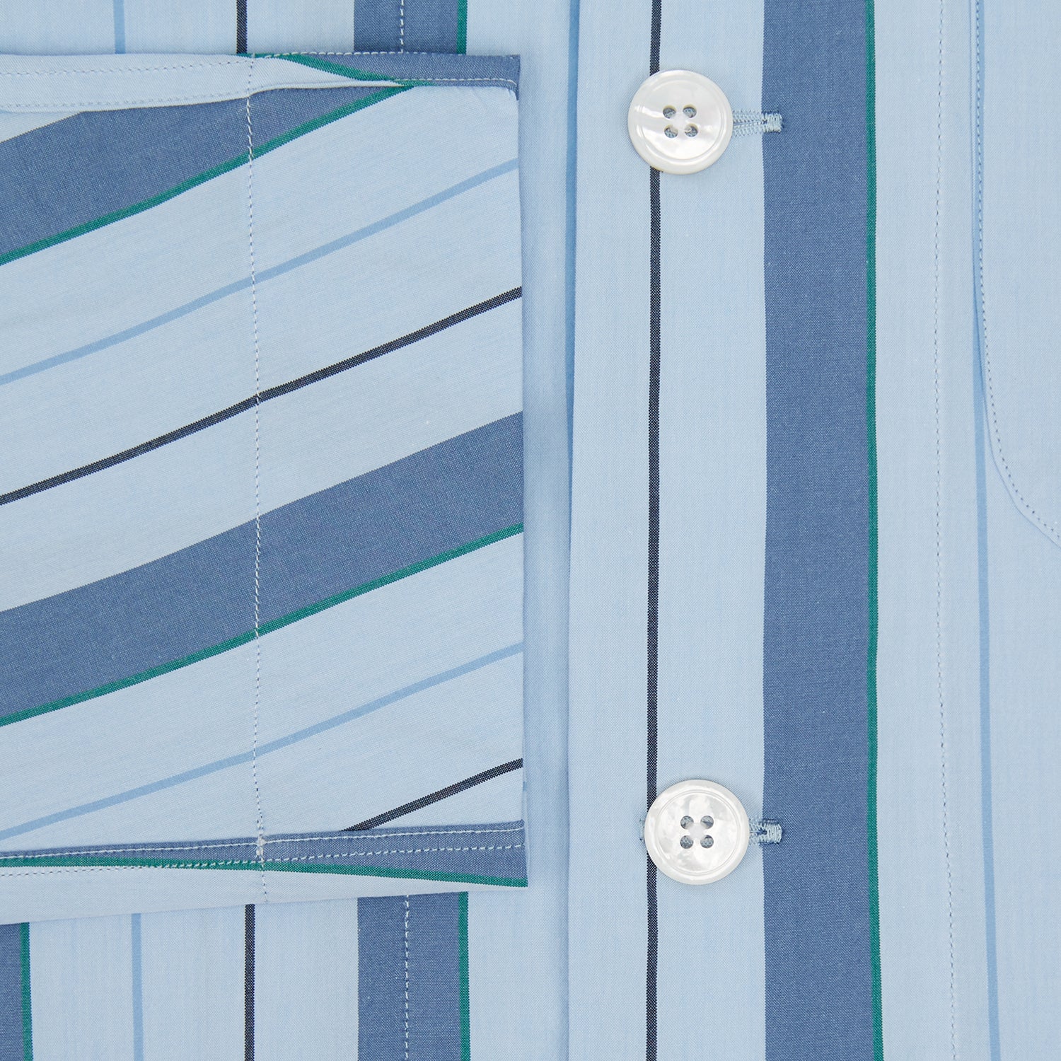 View 4 of product The Blue Baiadera Stripe Pyjama Shirt by Turnbull & Asser features long sleeves, a chest pocket, and a notched collar for an elegant nightwear look, shown on a white background.